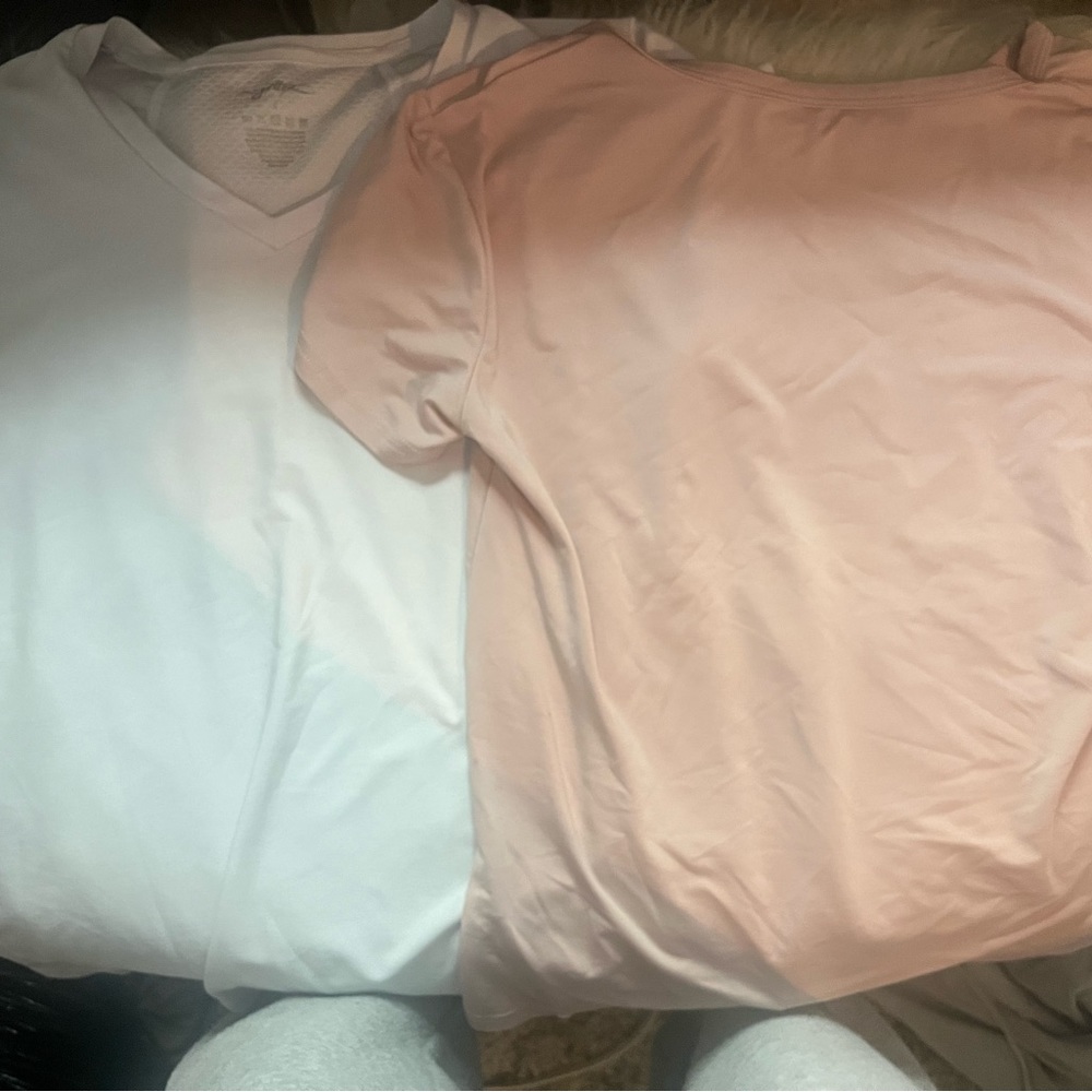 A white size size( looks medium) athletic top! A size small pink athletic top!
